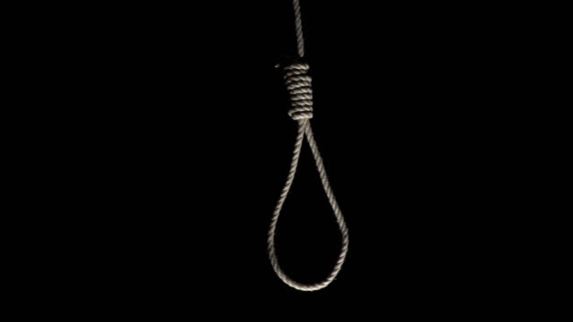 rope-noose-hanging-on-black-background-video-id661954882?s=640x640